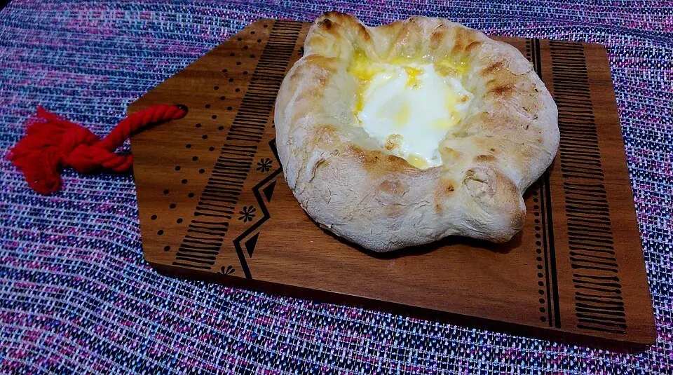 Adjarian khachapuri with egg yolk and butter