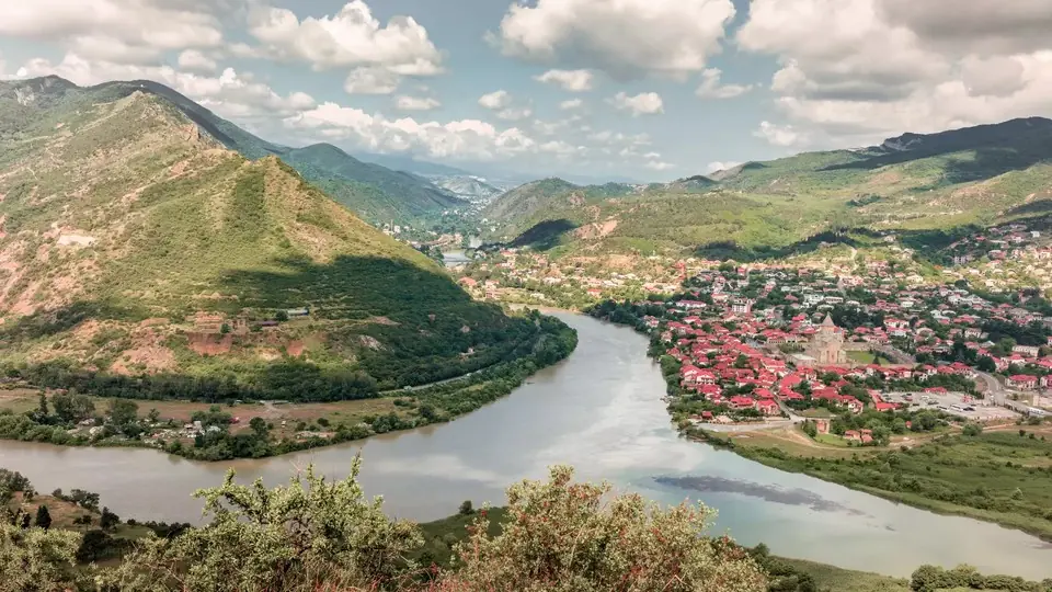 View from a hill over Mtskheta town and the wide river bend at the confluence