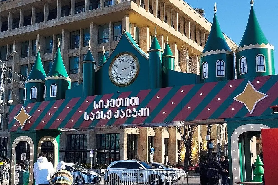 The green turreted gate of the New Year Village market on First Republic Square in Tbilisi, January 2026