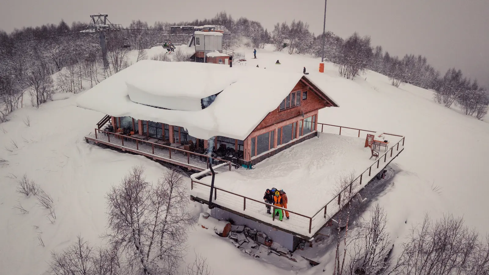 Hatsvali ski area above Mestia with the chairlift top station and skiers on the slope