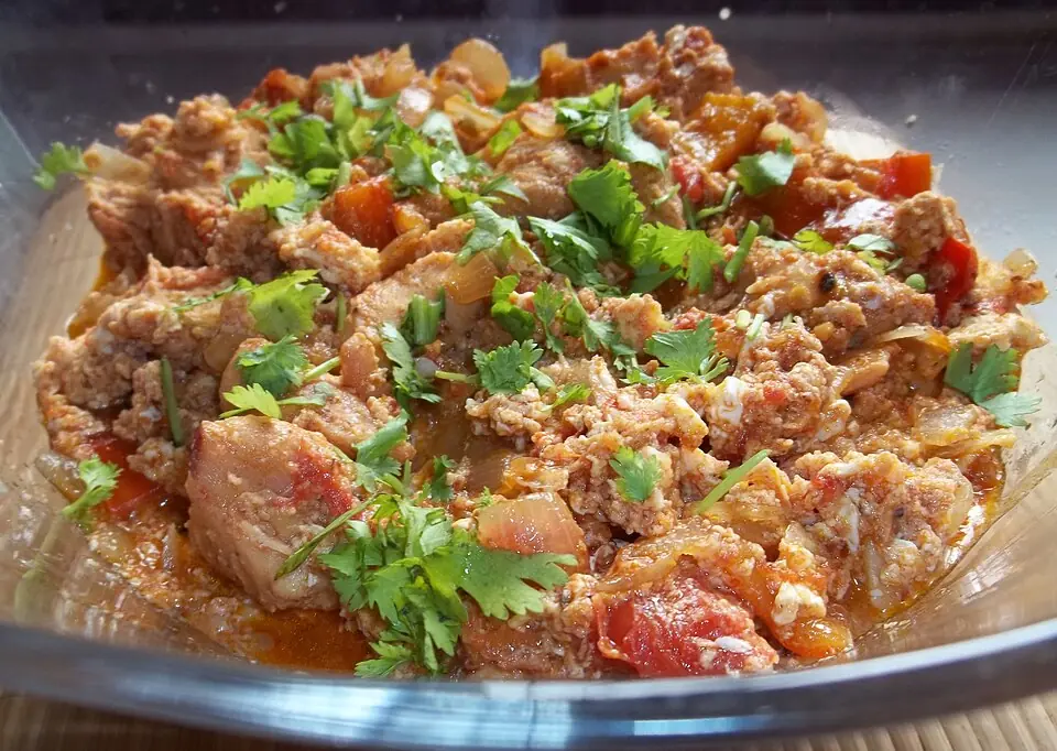 Chakhokhbili: pieces of chicken stewed with tomatoes, onions and peppers, topped with fresh coriander