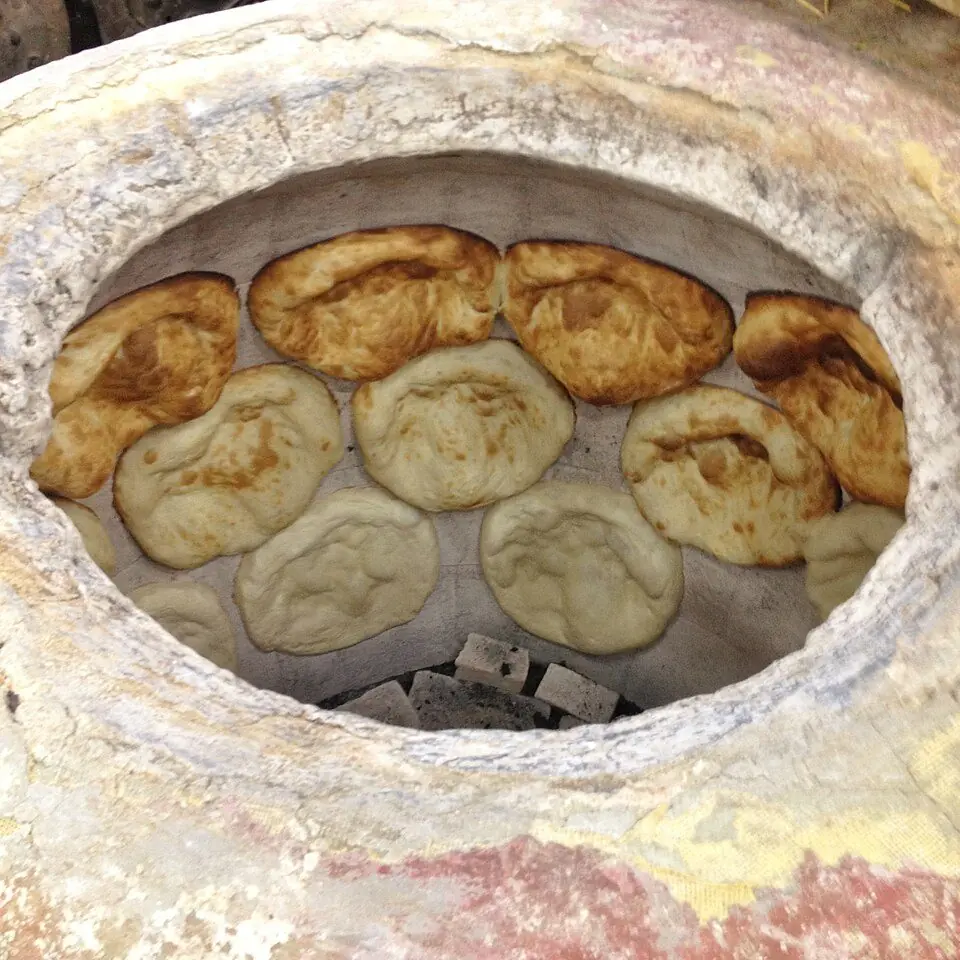 Tonis puri bread baking in a tone oven
